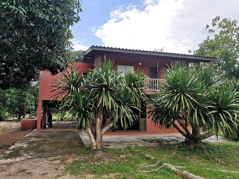 Land for sale 11 rai with a 2-story detached house, located by the river, offering a shady, Kanchanaburi
