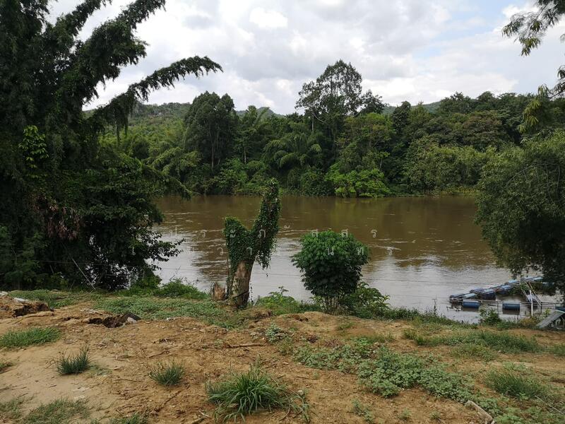 Land for sale 11 rai with a 2-story detached house, located by the river, offering a shady, Kanchanaburi