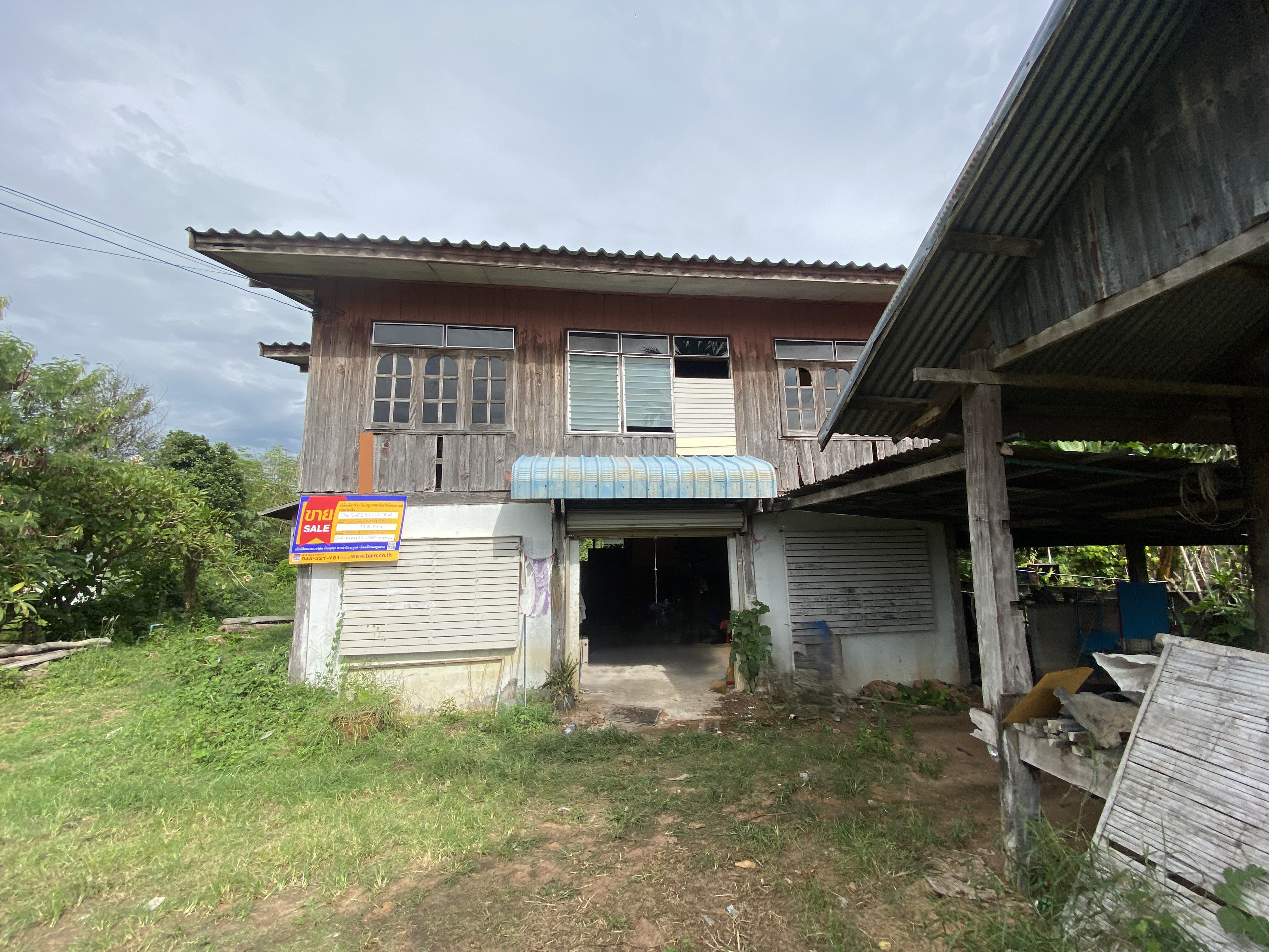 Two-story wood-frame house for sale in Khukhan.
